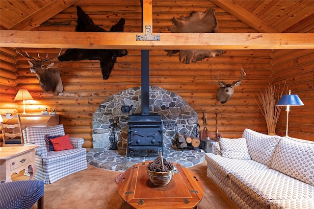 living room with beamed ceiling, wooden ceiling, a wood stove, and log walls