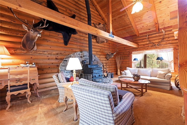 carpeted living room with log walls, high vaulted ceiling, beam ceiling, wooden ceiling, and a wood stove