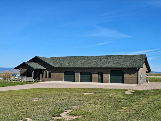 39879 Ingram Ln, Polson, MT 59860 - view of front of property featuring a front lawn and covered porch
