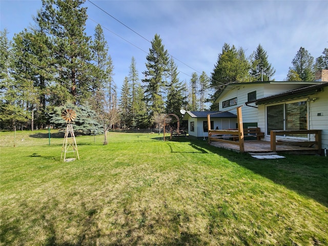 view of yard featuring a wooden deck