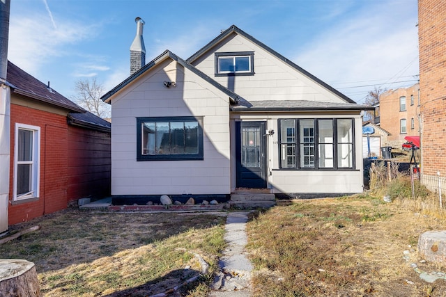 735 Placer St, Butte, MT 59701 - view of front of house with entry steps, a chimney, and a shingled roof
