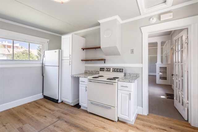 735 Placer St, Butte, MT 59701 - kitchen with white appliances, open shelves, light wood-type flooring, white cabinetry, and ornamental molding