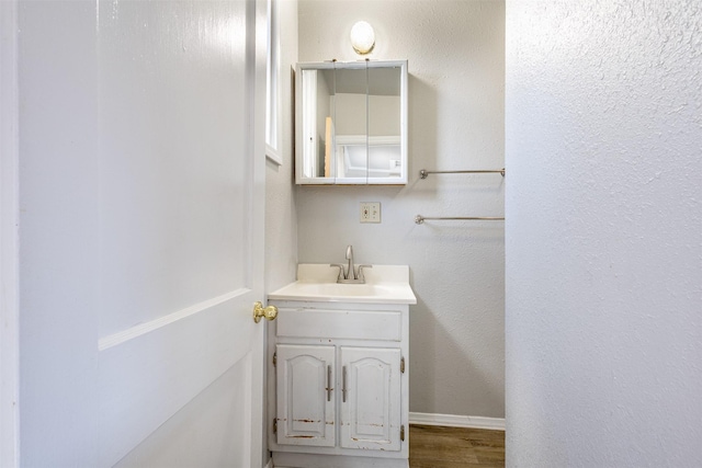735 Placer St, Butte, MT 59701 - bathroom featuring vanity and wood finished floors