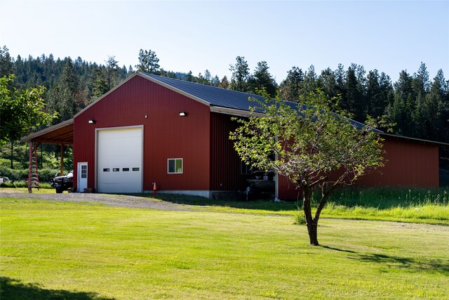 garage with a yard