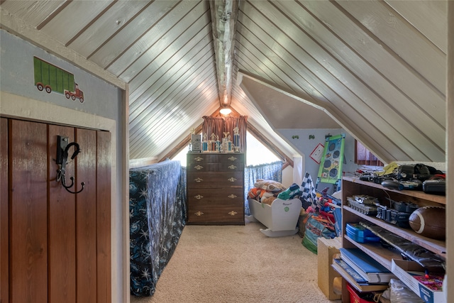 carpeted bedroom featuring vaulted ceiling with beams