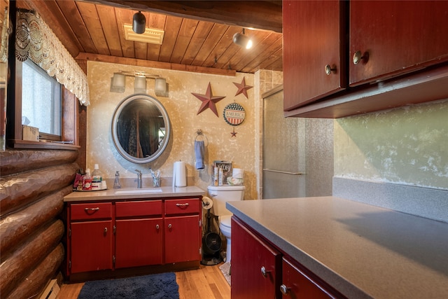 kitchen featuring wood ceiling, sink, and light wood-type flooring