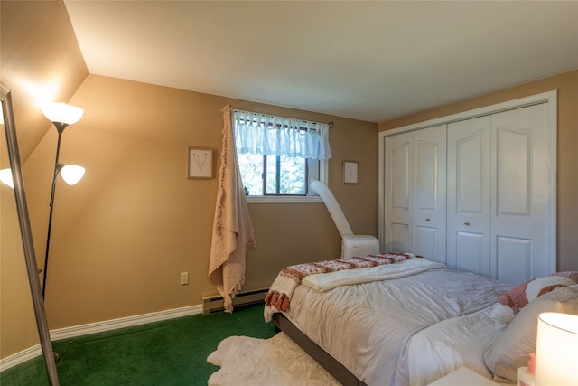 carpeted bedroom featuring a closet and baseboard heating