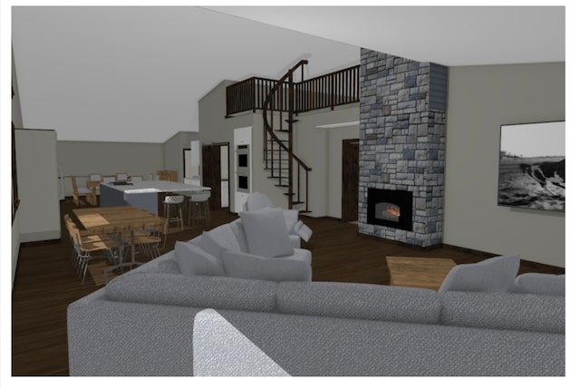 living room featuring dark wood-type flooring, lofted ceiling, and a stone fireplace