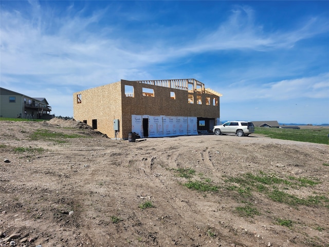 rear view of property with a balcony