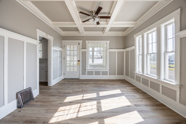 unfurnished sunroom featuring beamed ceiling, coffered ceiling, and ceiling fan