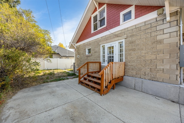 back of house with french doors and a patio area