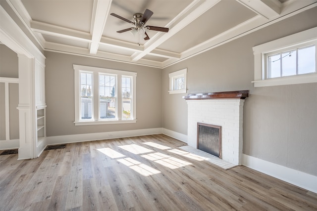 unfurnished living room featuring light wood-type flooring, a fireplace, and coffered ceiling