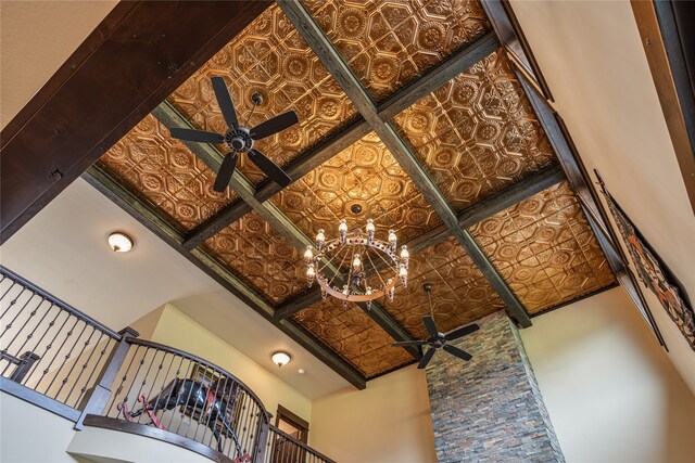 interior details featuring ceiling fan with notable chandelier