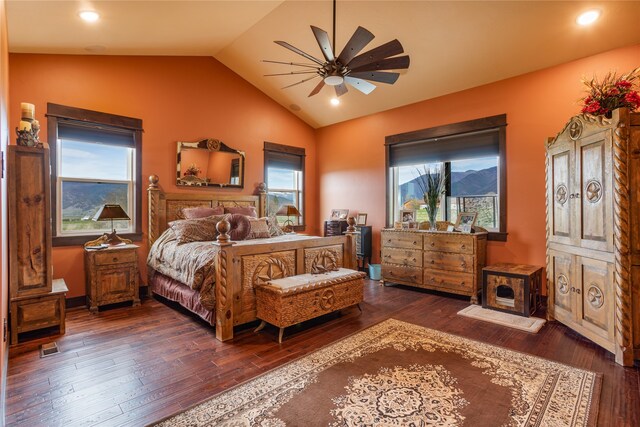 bedroom with vaulted ceiling, ceiling fan, and dark hardwood / wood-style floors