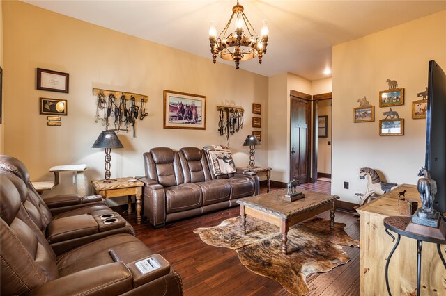 living room with a chandelier and dark hardwood / wood-style flooring