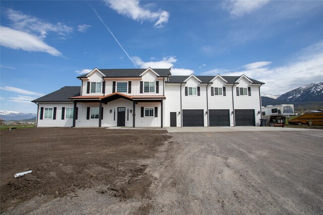 view of front of house featuring a mountain view and a garage