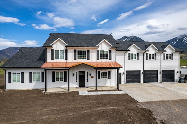 view of front facade featuring a mountain view and a garage