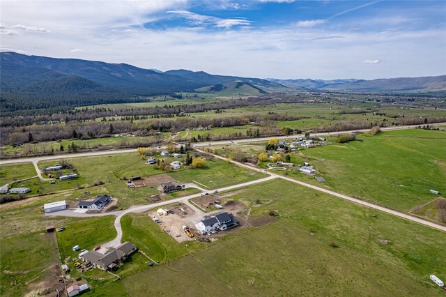 birds eye view of property with a mountain view