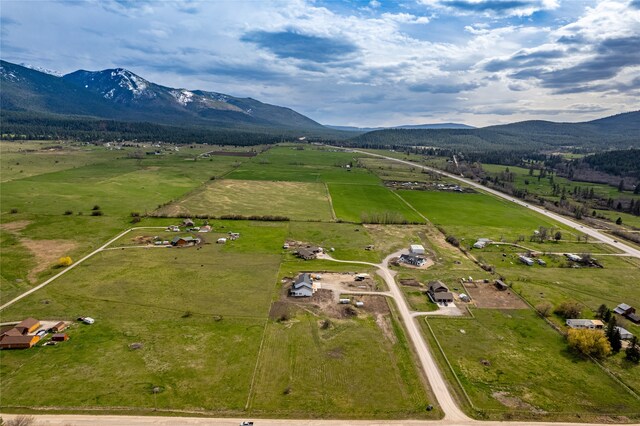 bird's eye view with a mountain view and a rural view