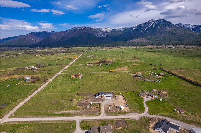 bird's eye view featuring a mountain view and a rural view