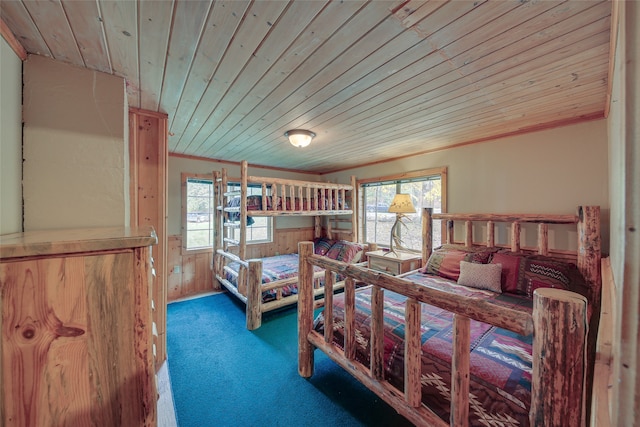 bedroom featuring carpet flooring and wood ceiling