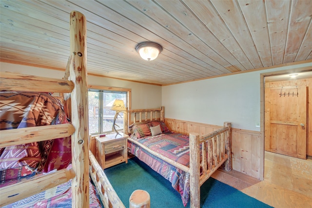 bedroom with wood ceiling and crown molding