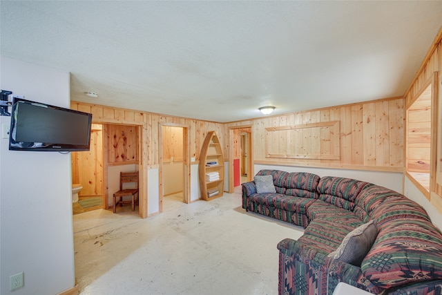 living room featuring wood walls