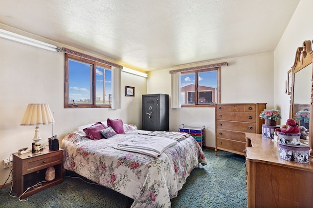 carpeted bedroom with a textured ceiling