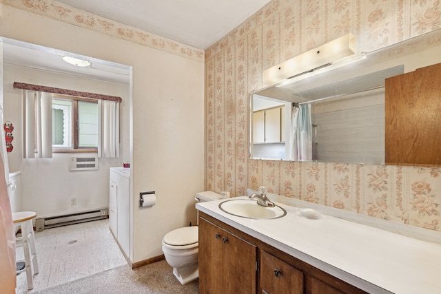 bathroom with toilet, oversized vanity, a baseboard radiator, and tile flooring