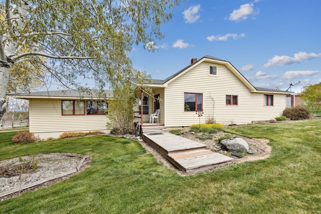 1848 Mountain View Orchard Rd, Corvallis, MT 59828 - back of house with a lawn and a chimney