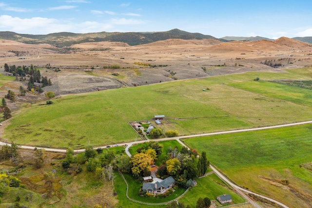 drone / aerial view with a mountain view and a rural view