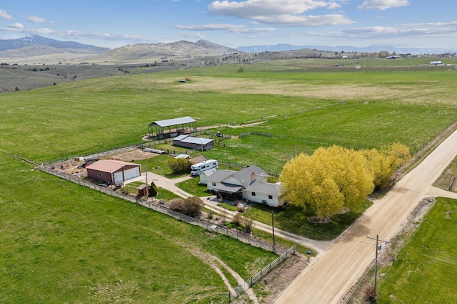 birds eye view of property with a rural view and a mountain view