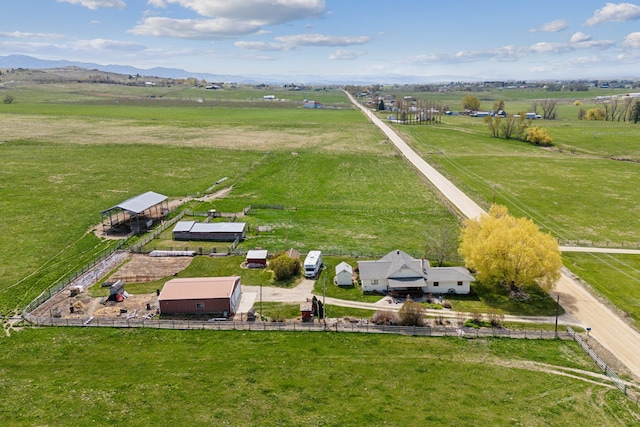 birds eye view of property with a rural view