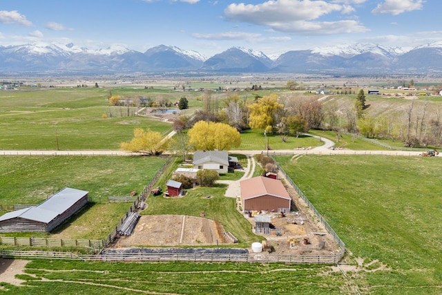 birds eye view of property with a mountain view and a rural view