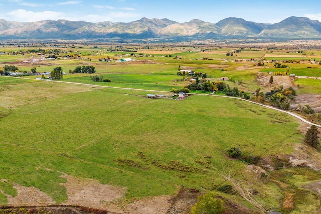 drone / aerial view featuring a mountain view and a rural view