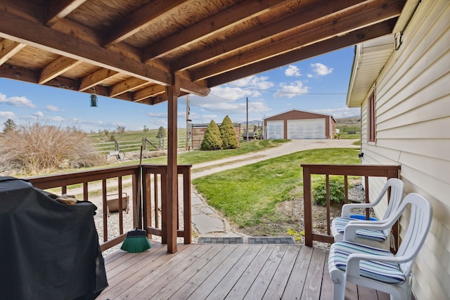 deck with an outdoor structure, a garage, and a grill