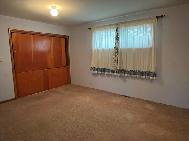 unfurnished bedroom featuring carpet floors