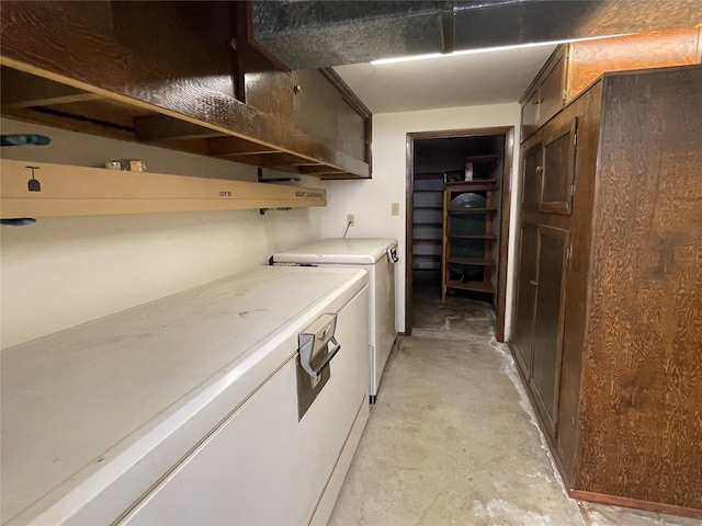 laundry room with washing machine and clothes dryer