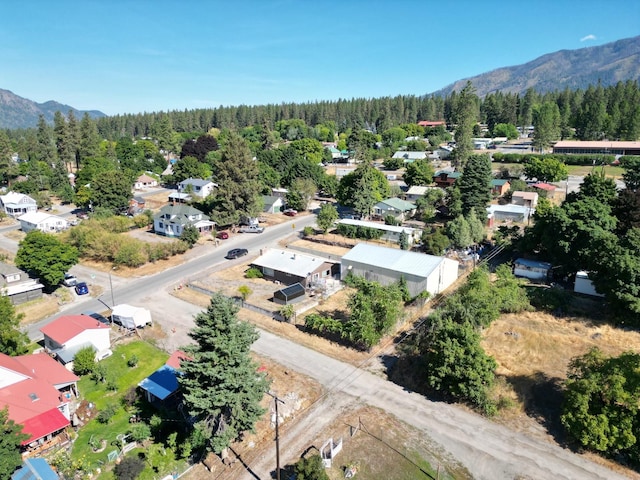 birds eye view of property with a mountain view