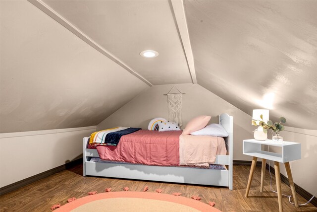 bedroom with hardwood / wood-style flooring and vaulted ceiling