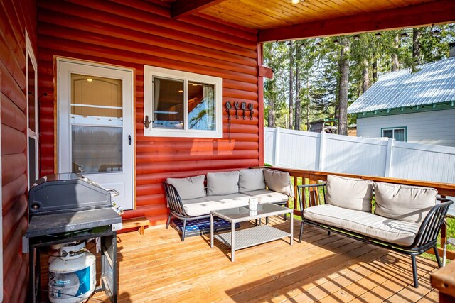 wooden deck featuring outdoor lounge area