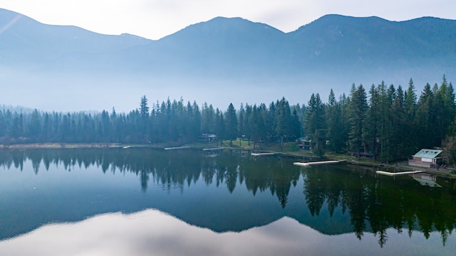 bird's eye view with a water and mountain view