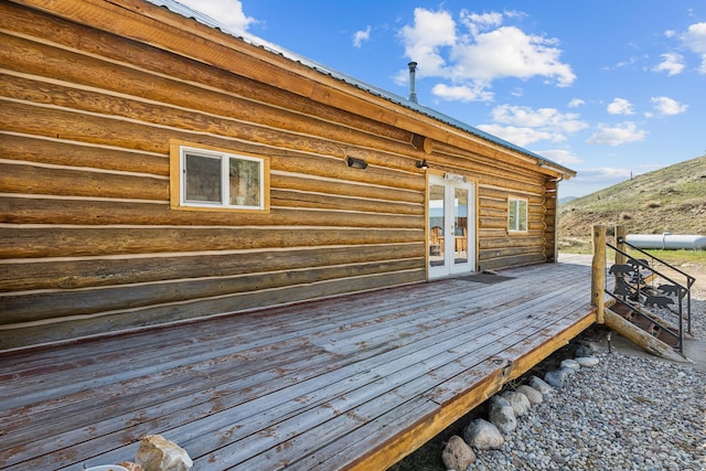 wooden deck featuring french doors