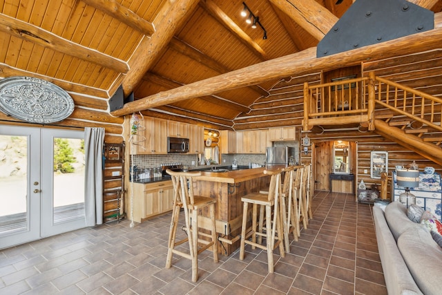 kitchen featuring high vaulted ceiling, backsplash, wooden ceiling, appliances with stainless steel finishes, and light brown cabinets