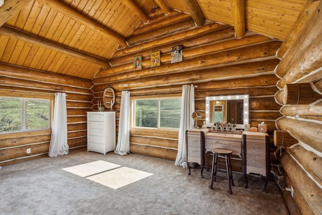 interior space with a healthy amount of sunlight, beamed ceiling, and log walls