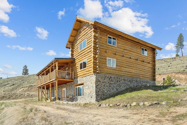 view of side of home featuring a deck