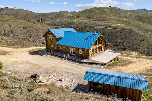 birds eye view of property with a mountain view