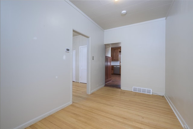 522 Hickory St, Anaconda, MT 59711 - unfurnished room with light wood finished floors, a smoke detector, and ornamental molding