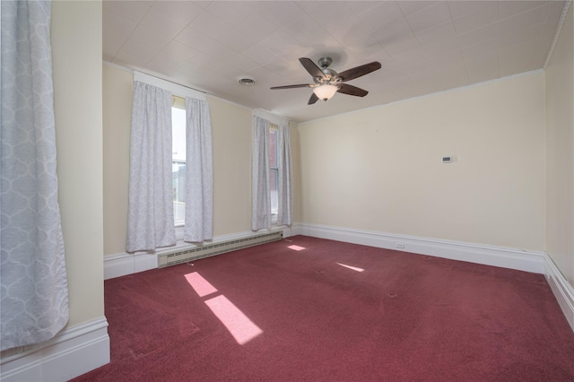 522 Hickory St, Anaconda, MT 59711 - spare room featuring a baseboard heating unit, carpet, and a ceiling fan