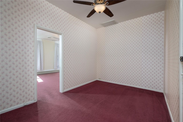522 Hickory St, Anaconda, MT 59711 - unfurnished room with ceiling fan, a baseboard heating unit, and dark carpet